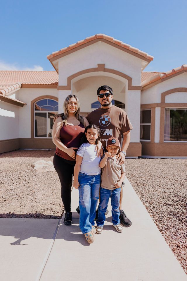 Happy Arizona family in front of their home